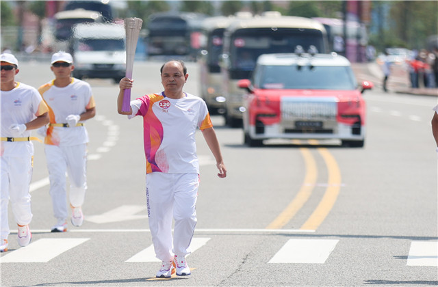 亚运火炬手韦晓青：参与“大莲花”建设，传递火炬一生难忘